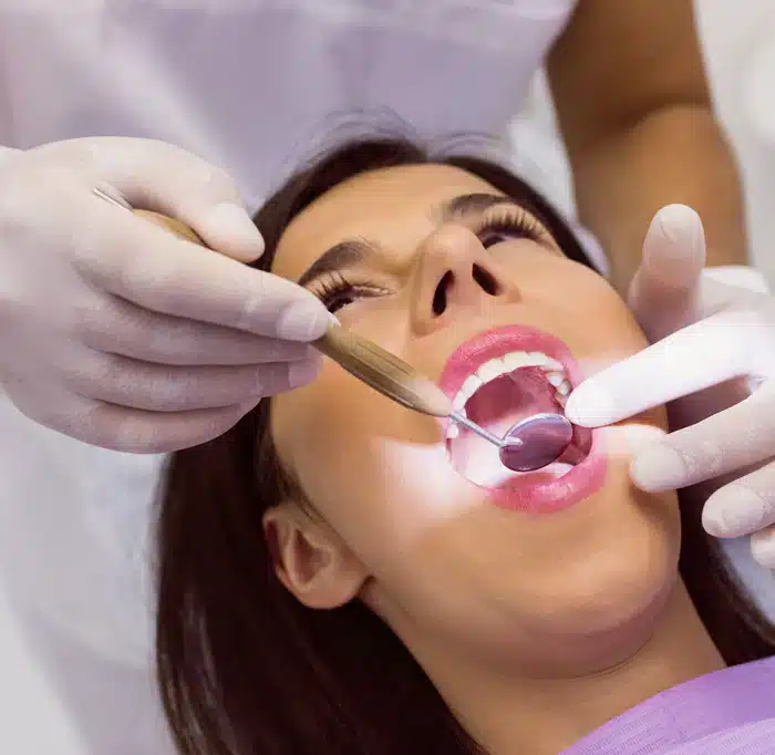 tooth being extracted at saks dental studio in allen