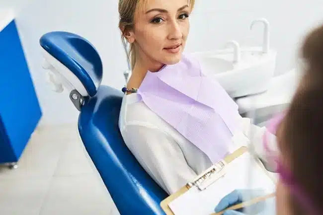female patient at saks dental studio after wisdom teeth removal in Allen